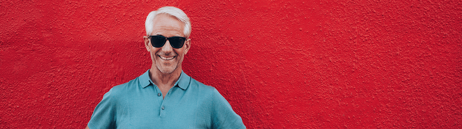 older man smiling in sunglasses