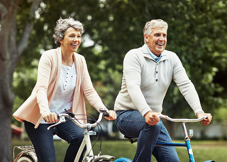 senior couple riding a bike