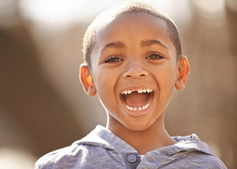 Happy boy with missing teeth