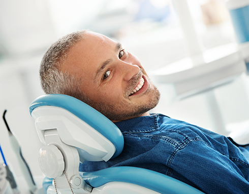 man smiling at dentist